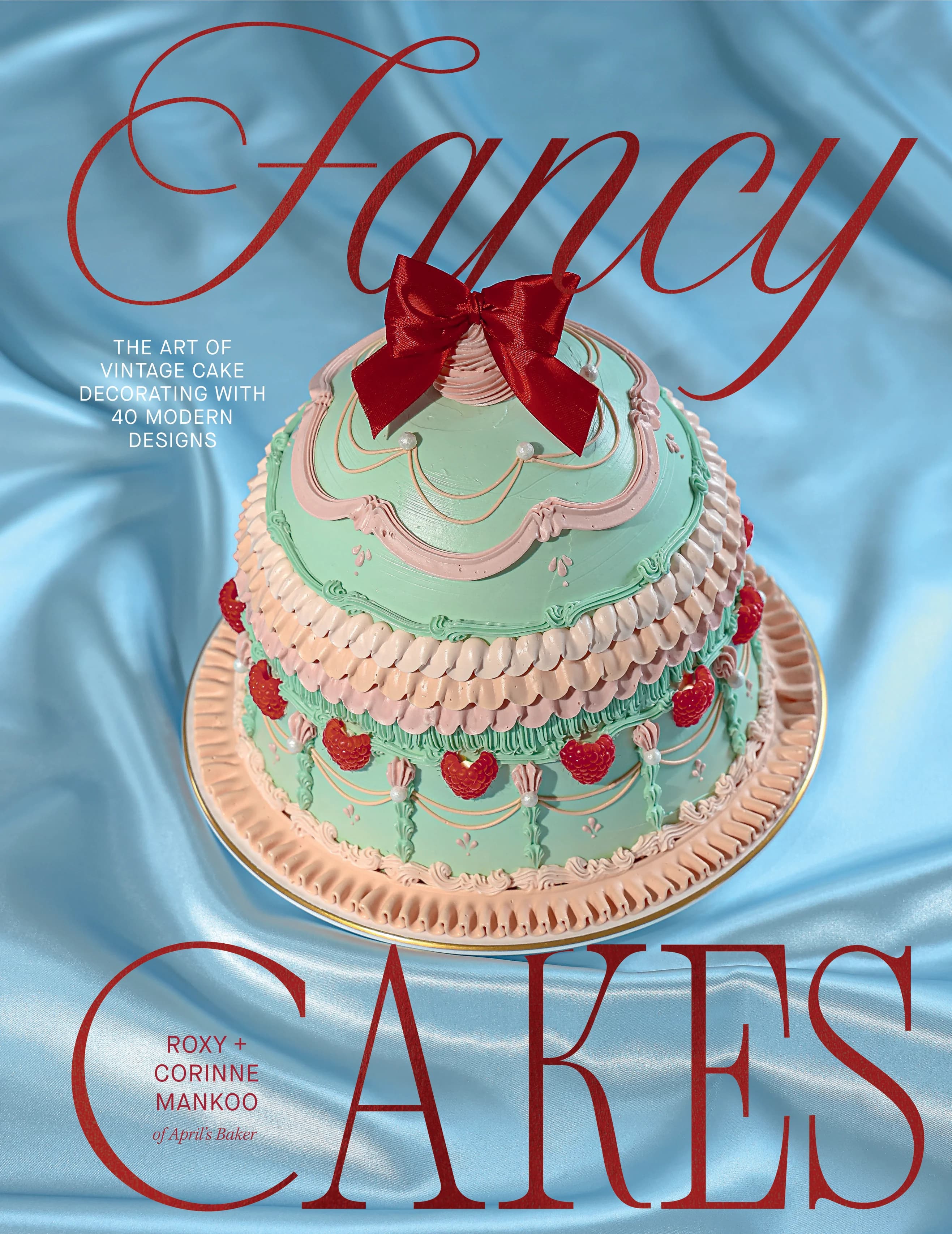 Fancy Cakes book cover featuring a mint green vintage cake with a red bow on blue satin