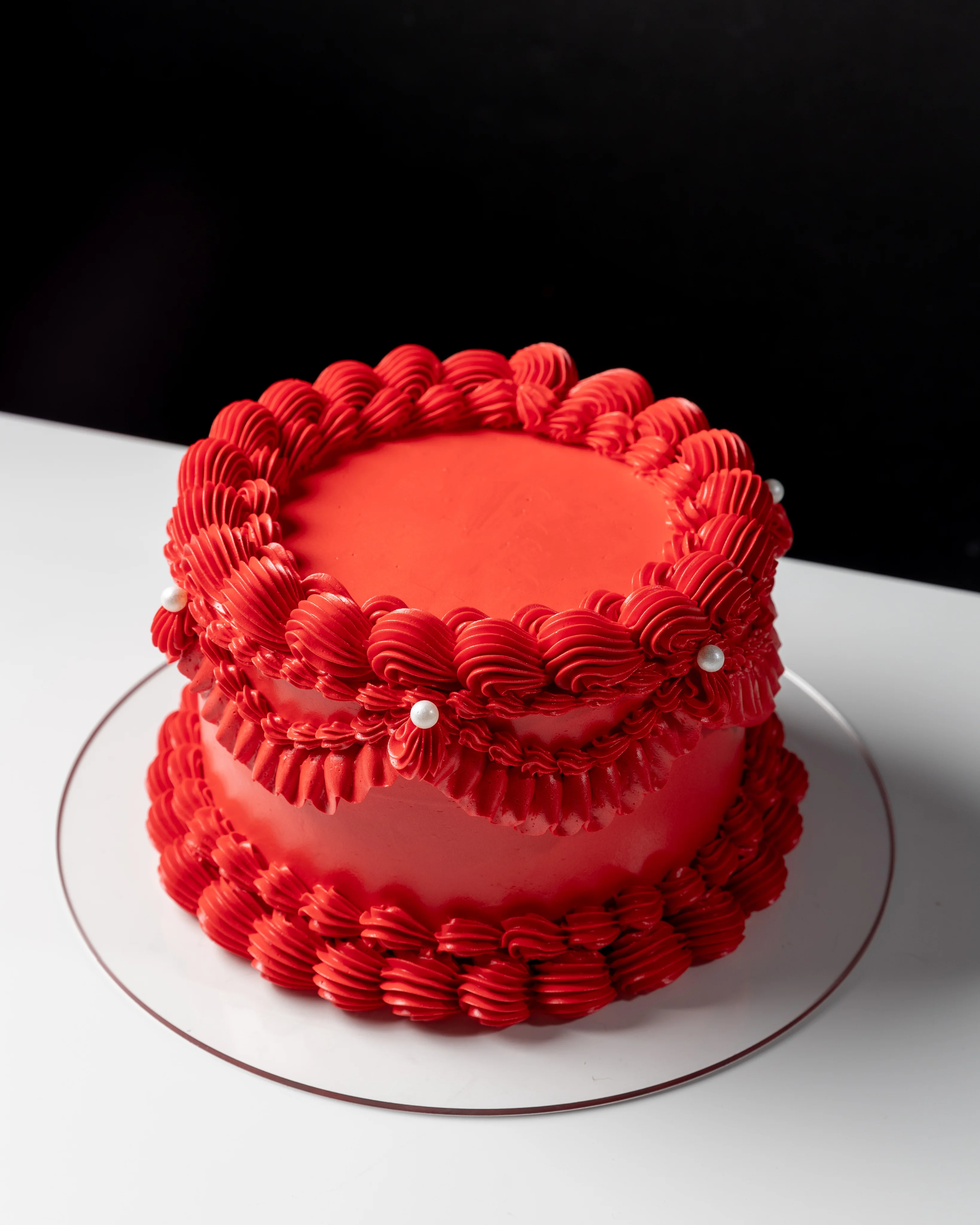 Pink heart-shaped cake made in class