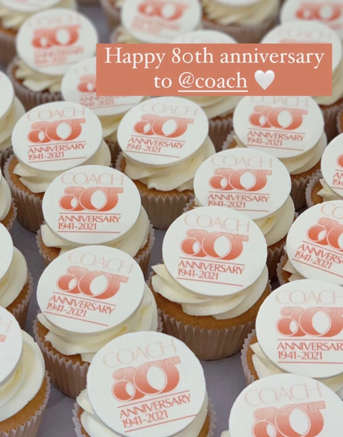 Cupcakes topped with Coach 80th anniversary logos, made for the brand's celebration