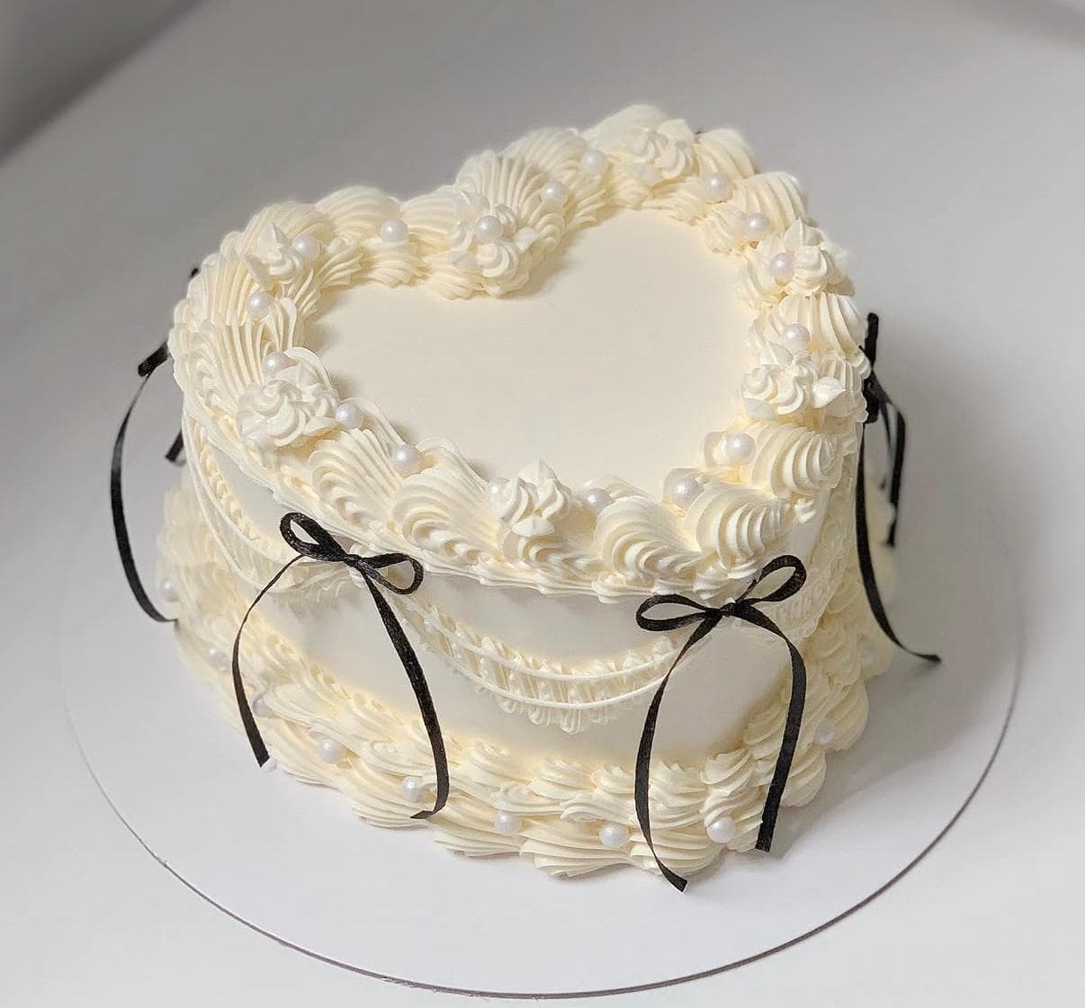 Pastel celebration cake with piped buttercream shells